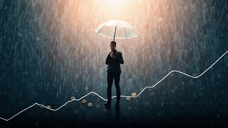 A photorealistic image of a person standing on a financial graph showing erratic ups and downs, holding an umbrella against a light rain of coins. The person looks calm and prepared. Cinematic lighting, sharp focus on the person, depth of field blurring the background, 8K hyper-detailed, professional photography, shot on a high-end DSLR.