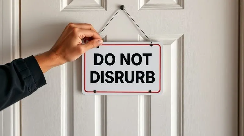A photorealistic image of a person's hands placing a 'Do Not Disturb' sign on a closed home office door. The door is modern and clean, with soft light from inside. Professional photography, 8K, cinematic lighting, sharp focus on the hands and sign, depth of field, shot on a high-end DSLR.