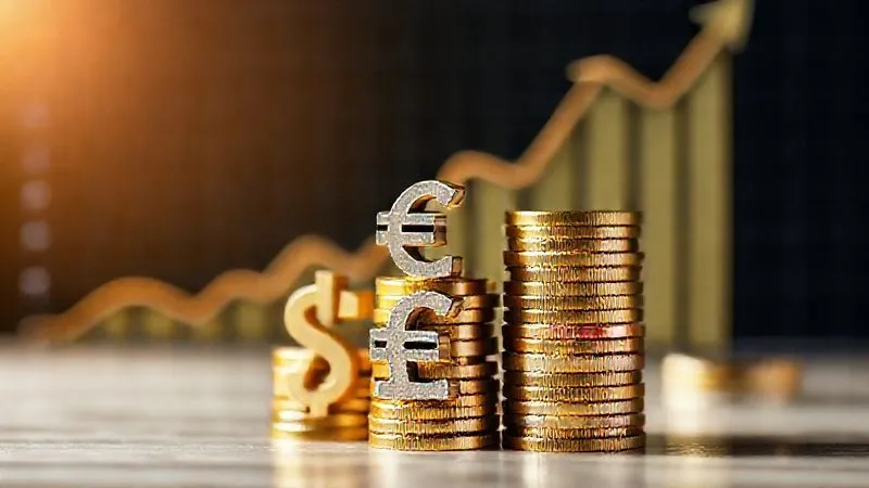 A photorealistic image of different currency symbols ($, €, £) stacked neatly like building blocks, with a graph showing upward growth in the background, representing diversified online revenue streams and financial stability. Professional photography, 8K, cinematic lighting, sharp focus on the currency blocks, depth of field, shot on a high-end DSLR.